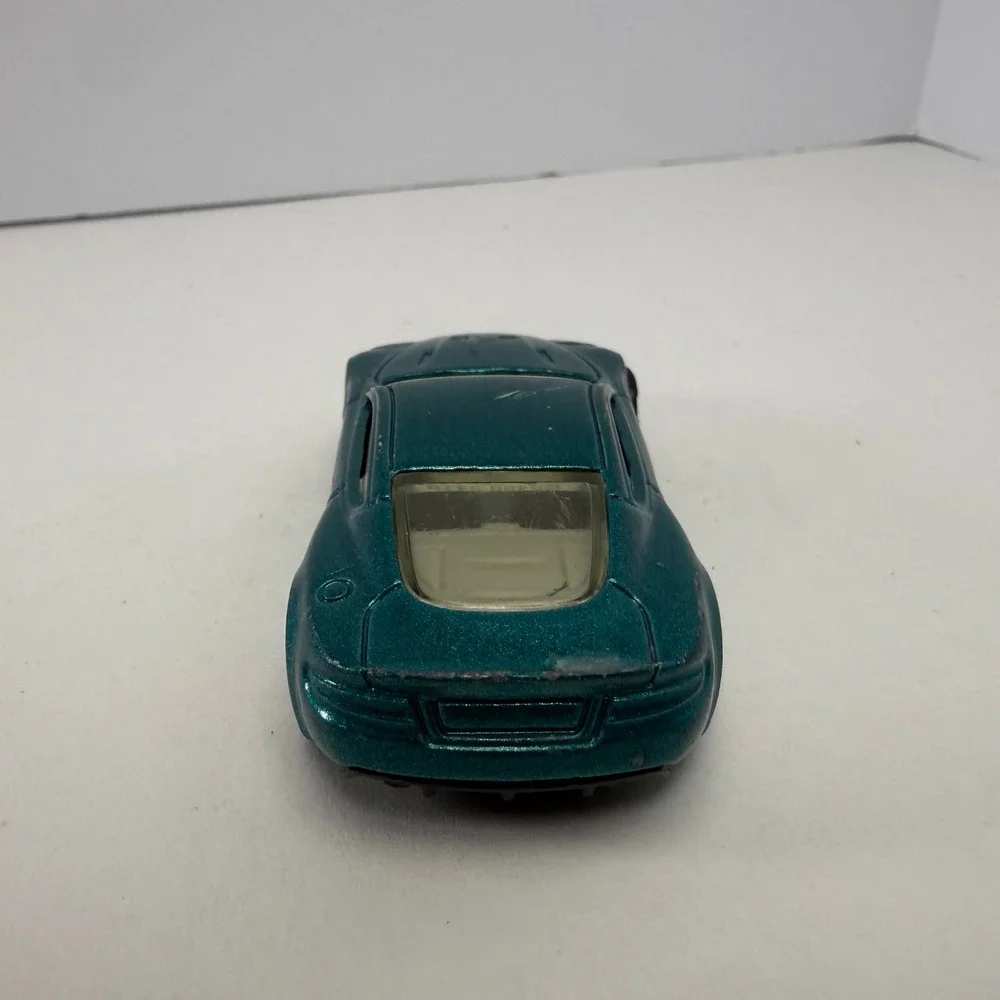 Hot Wheels Aston Martin DBS Metallic Teal 2010 All Stars 1/64 Diecast Car R6459
